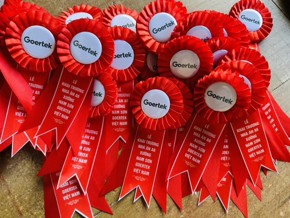 Mẫu hoa cài áo đại biểu