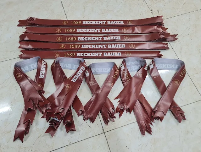 Băng rôn đeo đầu bằng vải