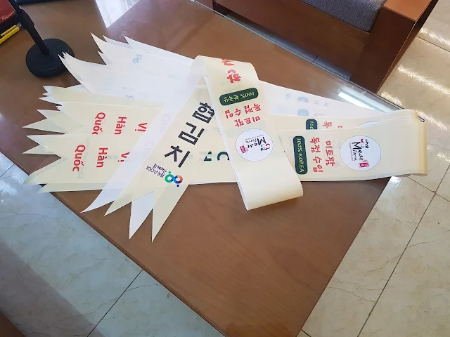 Băng rôn đeo đầu in logo công ty